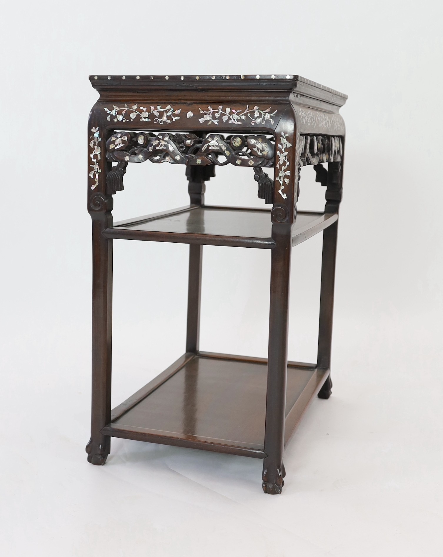 A late 19th century Chinese inlaid mother of pearl hongmu three tier table, 65cm wide, 40cm deep, 77.5cm high